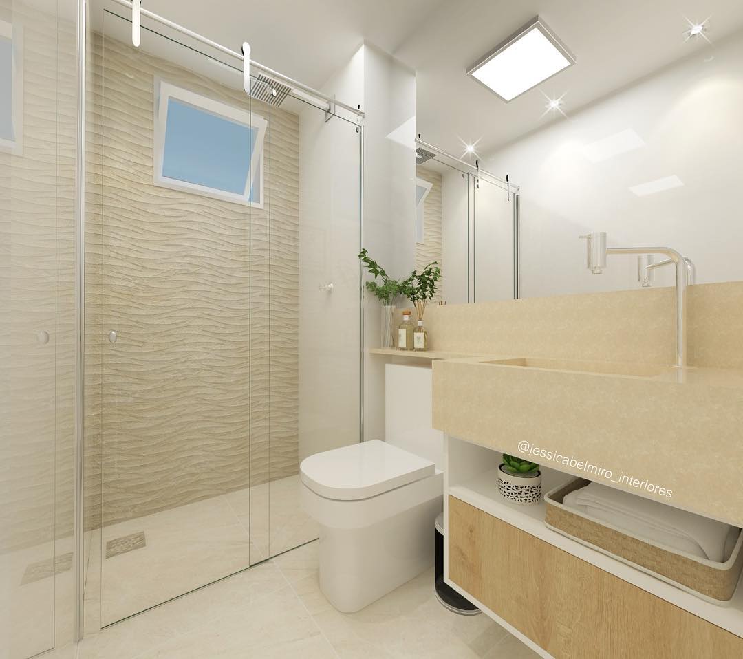 banheiro bege com pastilhas douradas