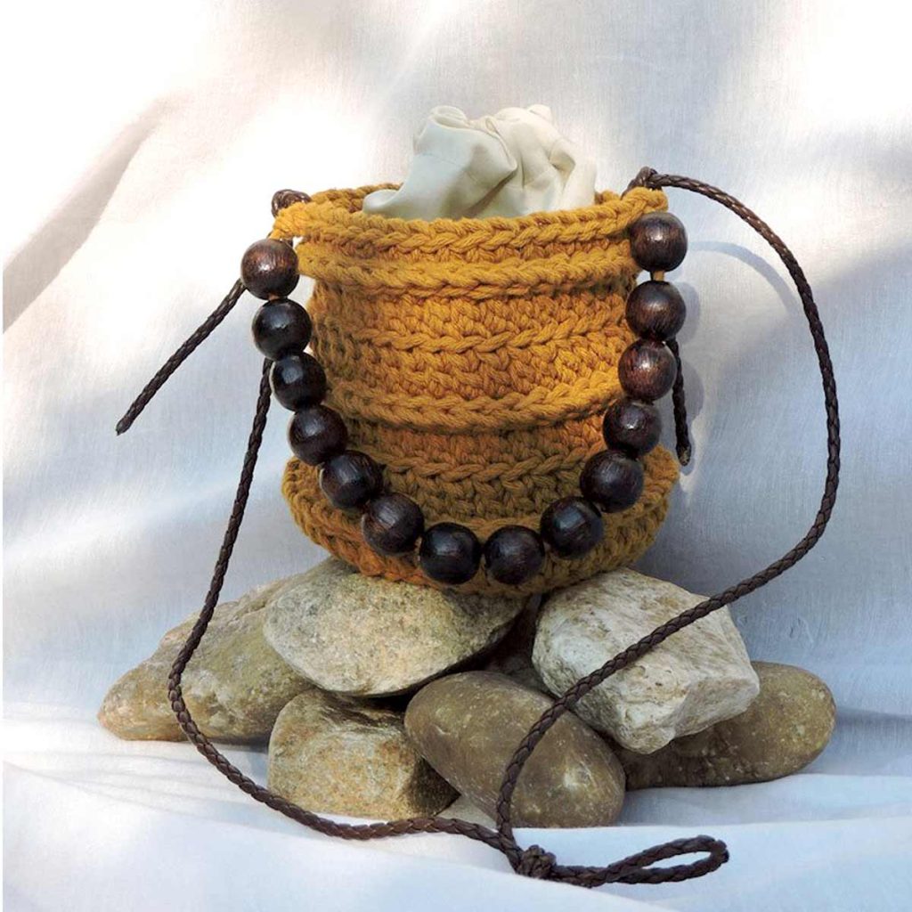 Bolsa de crochê redonda palha