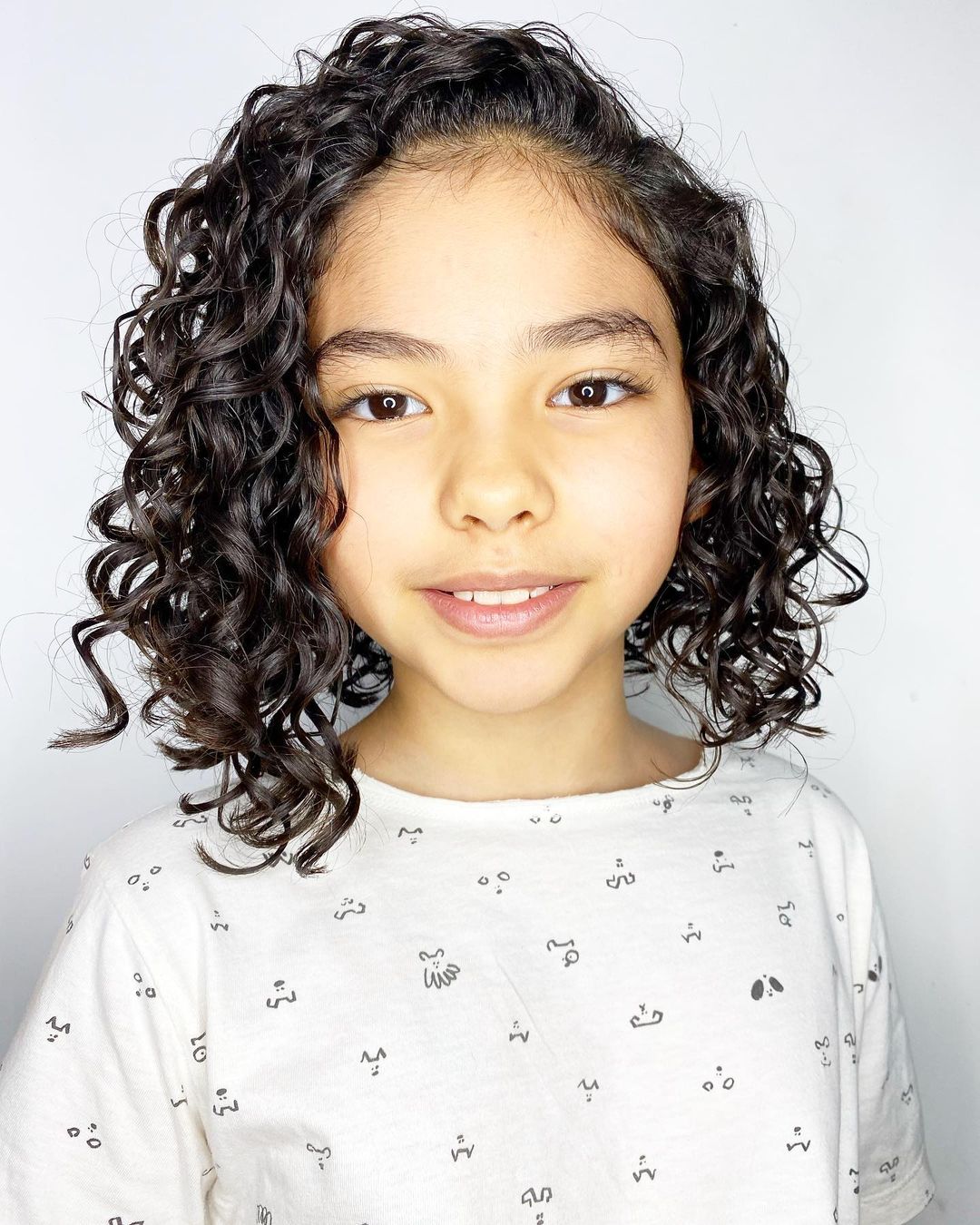 corte infantil cacheado feminino em camadas