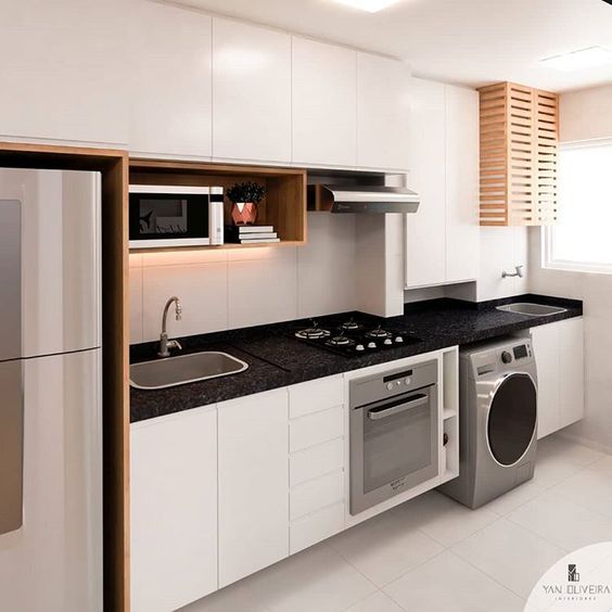 cozinha planejada com lavanderia oculta