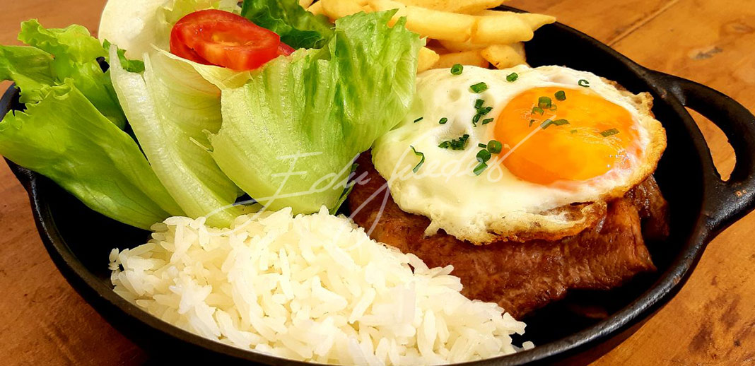 A História Fascinante do Bife a Cavalo: Da Europa ao Prato Feito