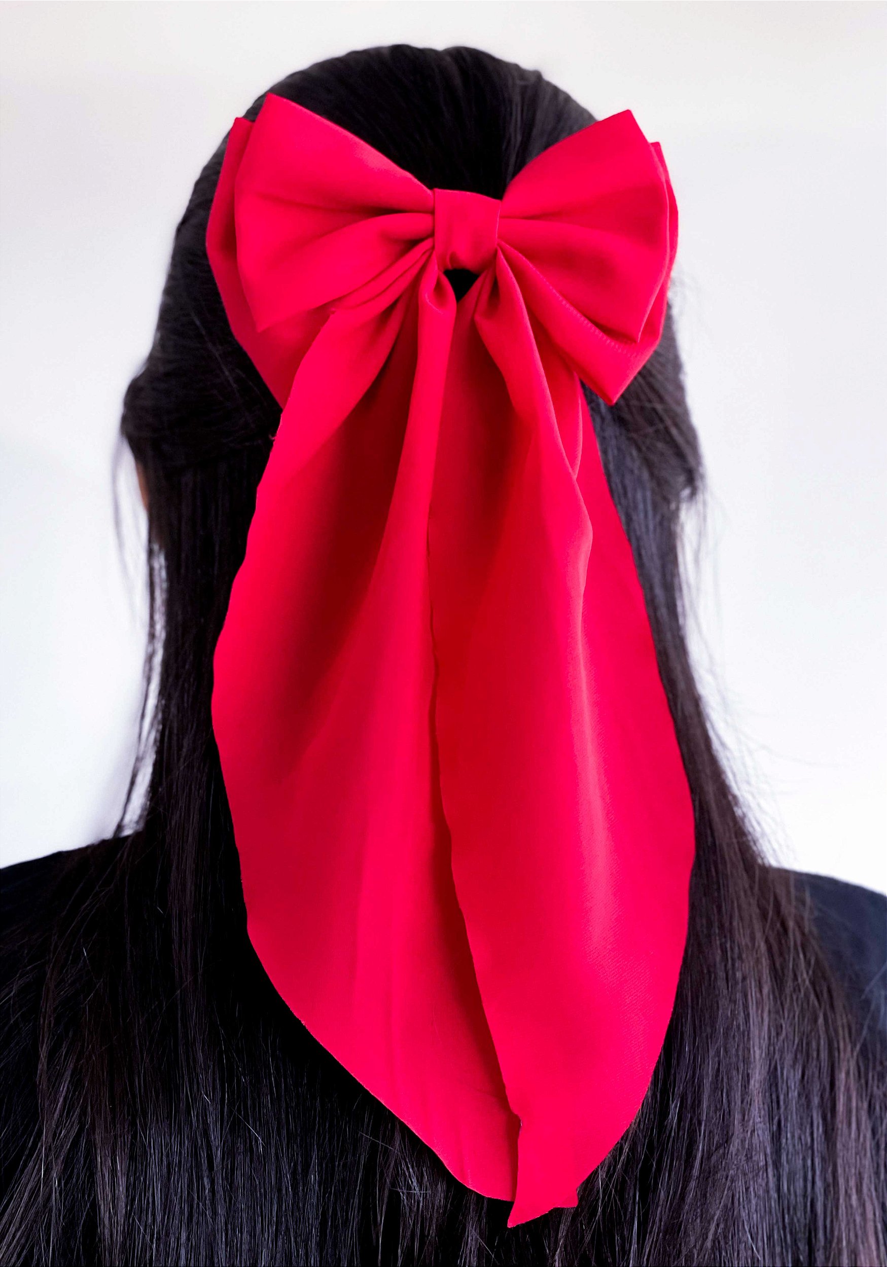 inspiração penteados com laço de cabelo grande