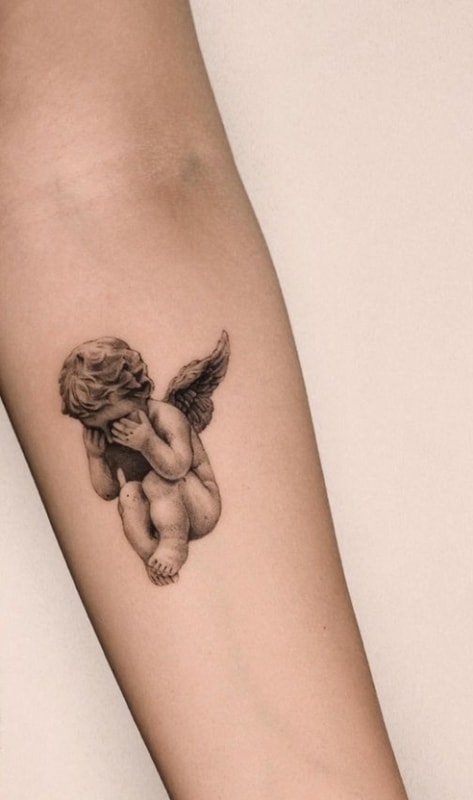 tatuagem de anjo na perna
