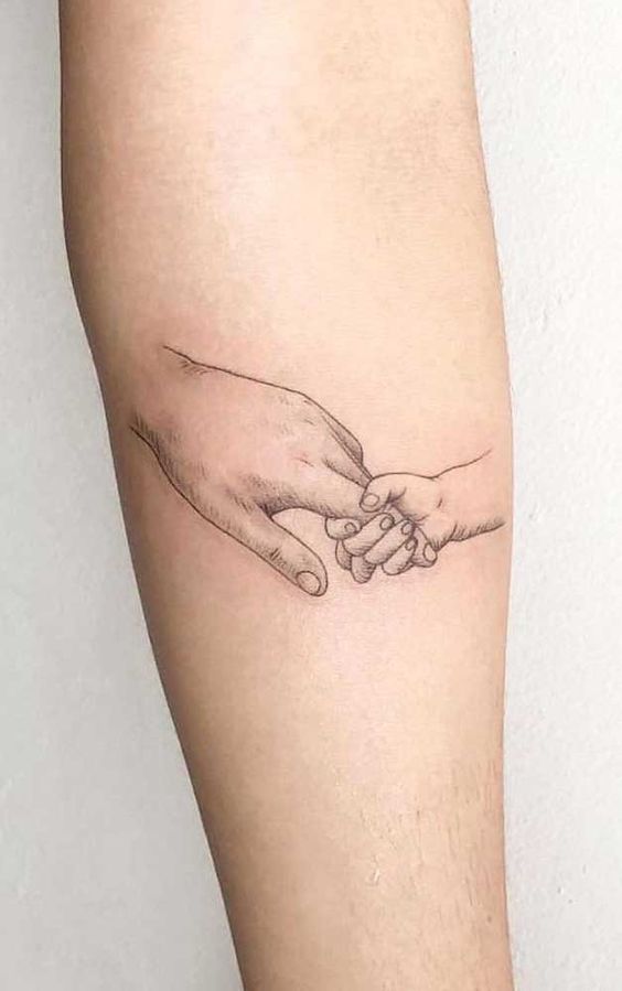 tatuagem pai e filho braço