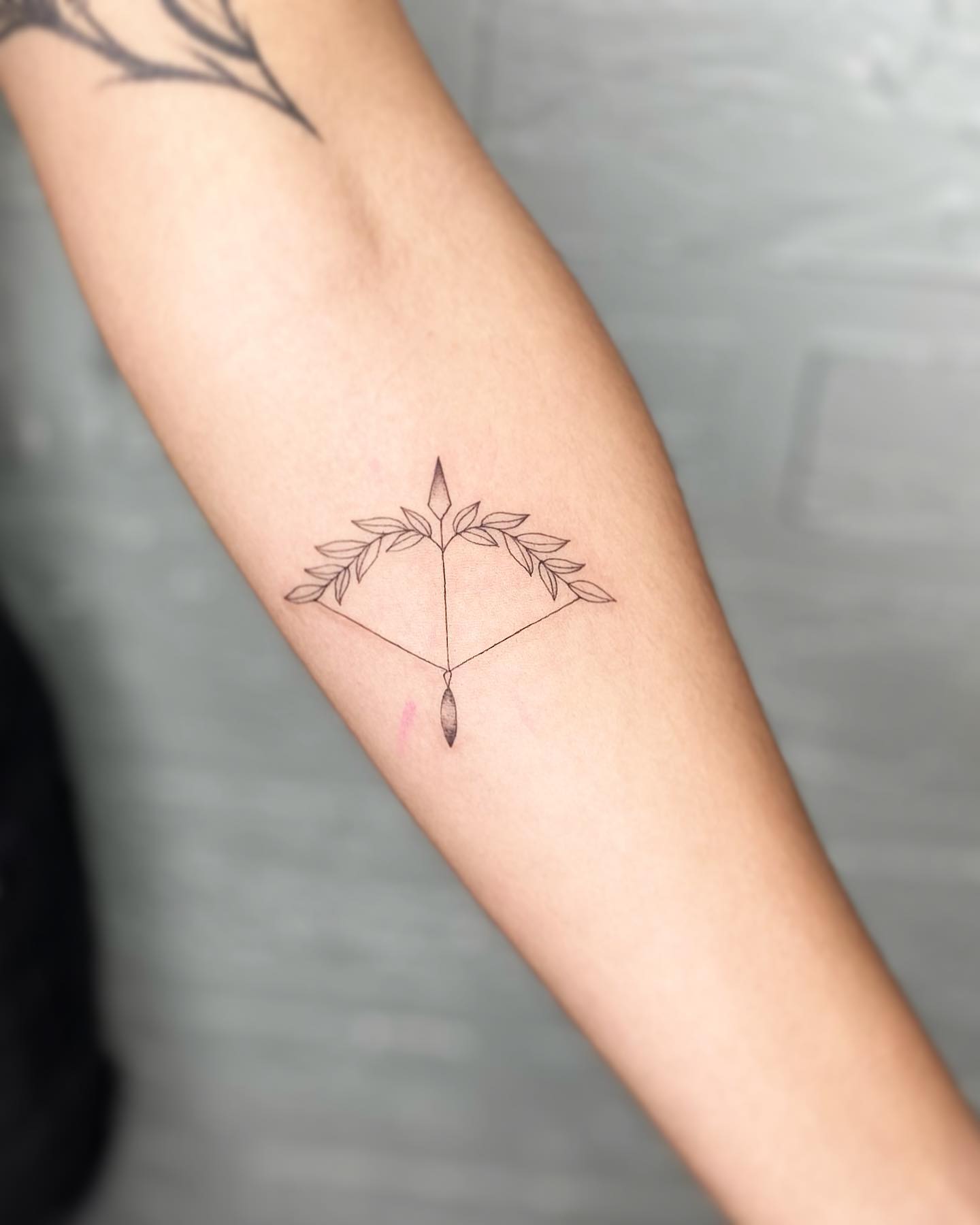 tatuagem sagitário delicada