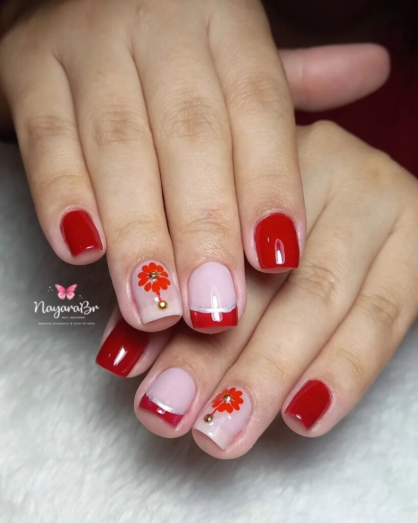 Unhas vermelhas delicadas com francesinha
