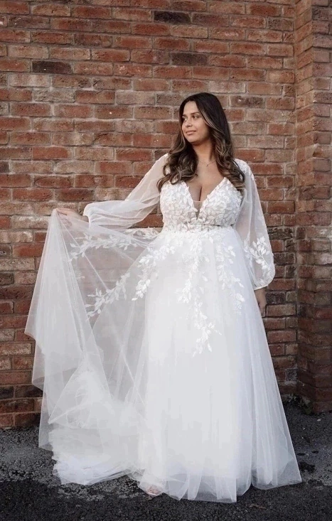 vestido de noiva plus size com mangas bufantes