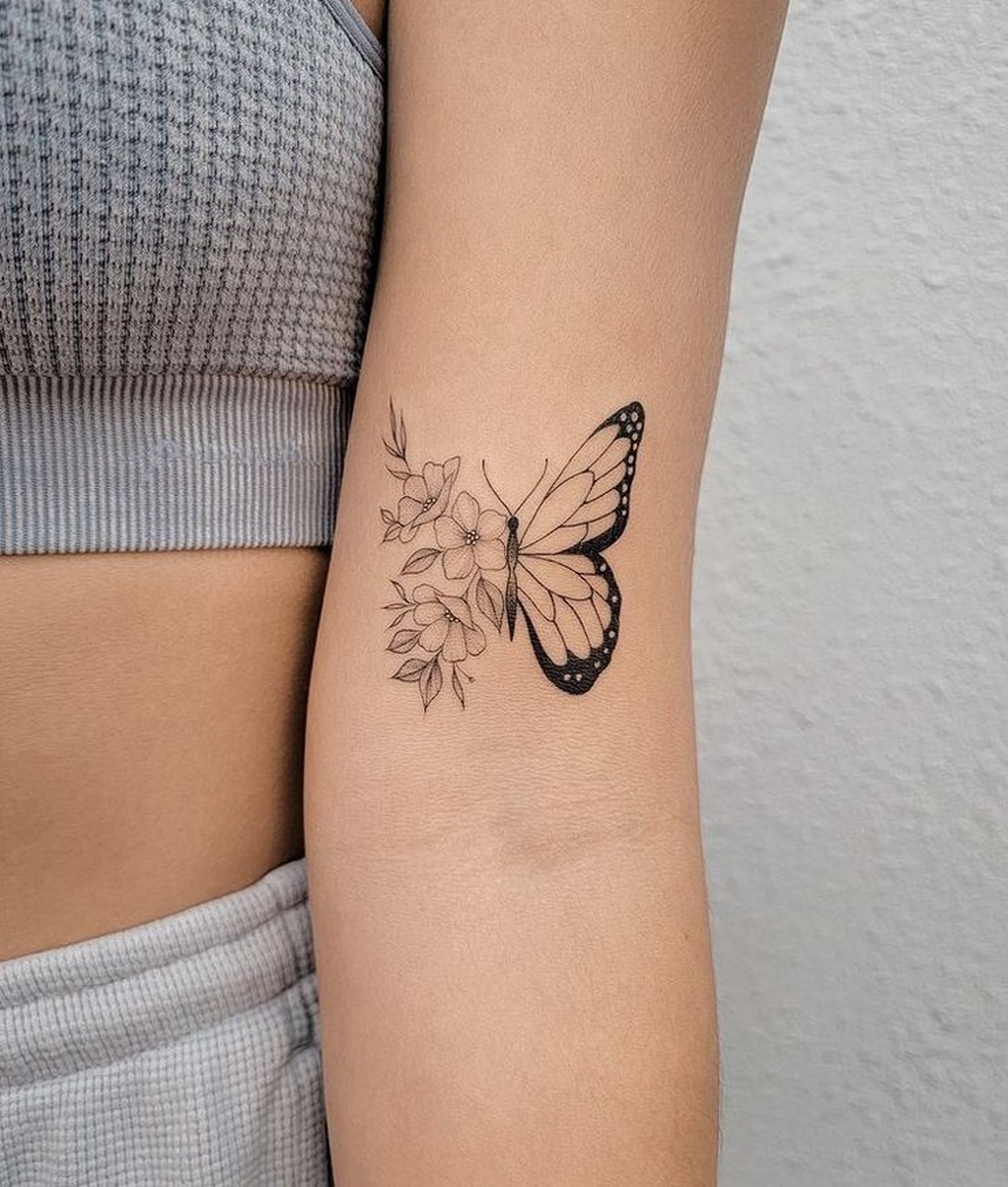 tatuagem borboleta minimalista braço